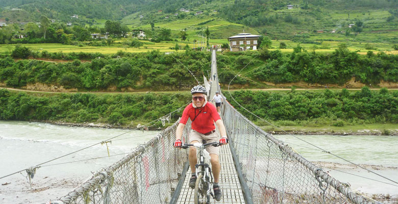 Biking cross Punakha suspension bridge